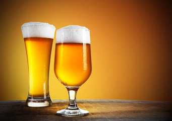 Beer glasses with gold background 
