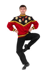 Attractive man wearing a folk russian costume dancing