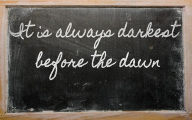 expression -  It is always darkest before the dawn - written on