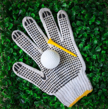 Golf Ball Hand Gloves And Yellow Tee