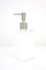 White liquid soap in transparent bottle