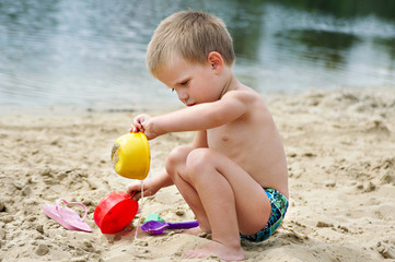 Child playing in the sand