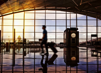 Airport terminal hall. Walking travelers