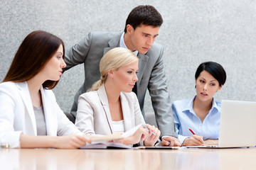 Business people discuss something at the meeting