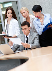 Business people discuss something at the meeting