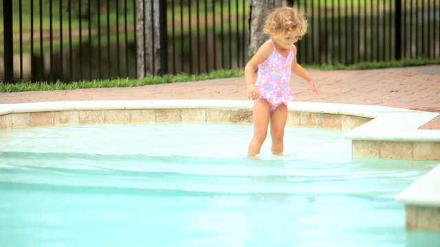 Little girl enjoying swimming pool