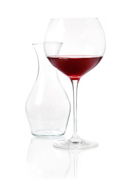 Glass of red wine with carafe