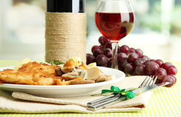 Roast chicken cutlet with boiled potatoes and cucumbers, glass