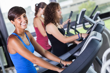 Fototapeta na wymiar People Running on Treadmill in the Gym