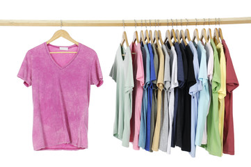 Rainbow colors. casual shirts on wooden hangers,