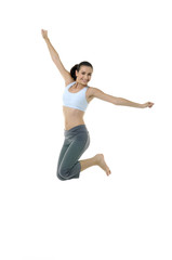 Fototapeta na wymiar Portrait of a pretty girl exercising *-jumping