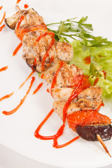 Chicken kebab with tomato sauce