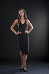 Fototapeta na wymiar A young woman in a black dress