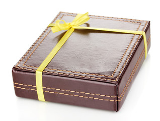 Brown box with ribbon isolated on white