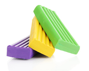 Children bright plasticine isolated on white