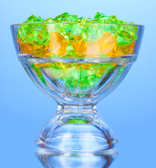 A glass with colorful decorative stones