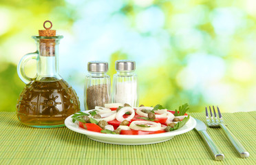 Salad with capers in the plate on bright green background