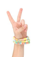 Color candies on hand isolated on white