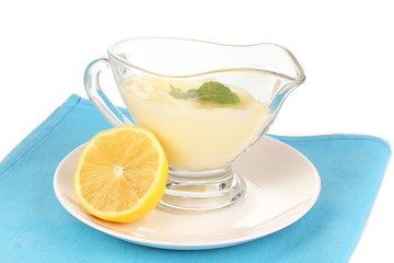 Mayonnaise in bowl on napkin isolated on white