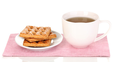 Cup of tea and cookies isolated on white