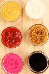 various sauces on chopping board close-up