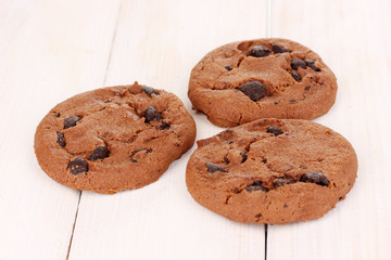 Chocolate chips cookie on wooden background