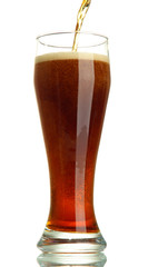 kvass poured into a glass, isolated on white
