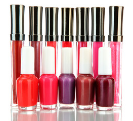 beautiful lip glosses and nail polish bottles, isolated on