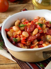 Beans with vegetables and smoked sausages