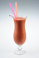 Berry smoothie with cherry over white background