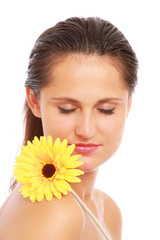 A young woman with a flower, isolated on white