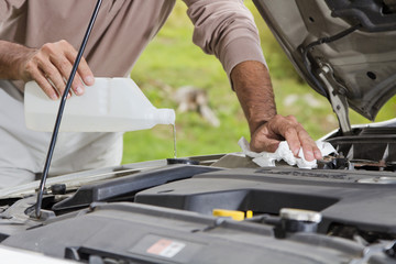 Filling the windshield washer fluid on a Car