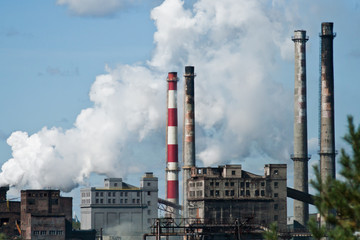 Obraz premium Factory with smoking chimneys