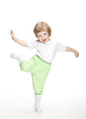 Happy playful little girl jumping and dancing