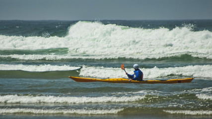 Kayaker in Surf at Cannon Beach Oregon