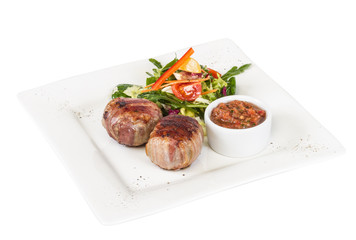 Grilled steak wrapped in bacon, with grilled vegetables, mashed