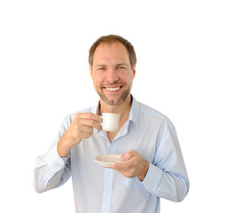 Smiling man drinking coffee isolated on white background