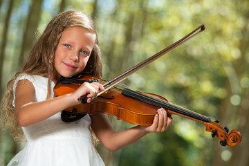Cute girl in white playing violin outdoors. © karelnoppe