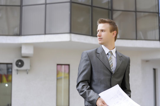 businessman holds contracts