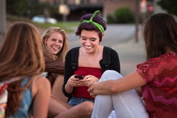 Hispanic Teen with Friends and Phone