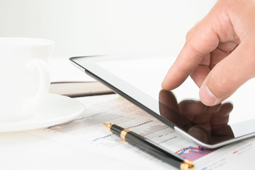 Hand touching screen of tablet pc