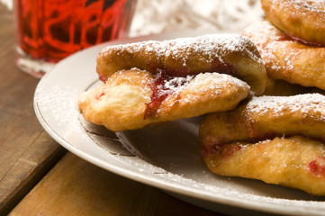 Dough with marmelade on wooden board