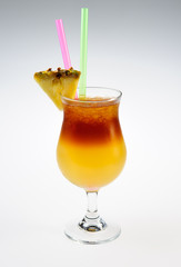 Alcohol cocktail with slice of pineapple over white background
