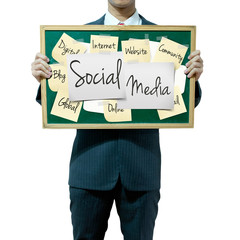 Business man holding board on the background, Social Media conce