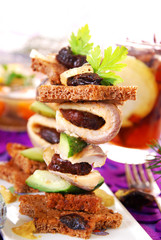 herring canapes with prune and gherkin for christmas