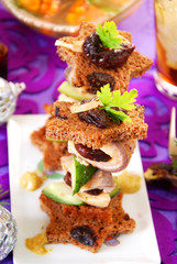 herring canapes with prune and gherkin for christmas
