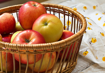 Fresh apples in bucket  on wooden background
