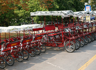Fototapeta na wymiar Parked quadricycles.