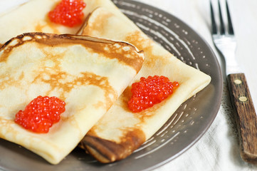 Pancakes with red caviar
