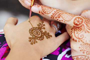 Henna art on woman's hand © videoroot